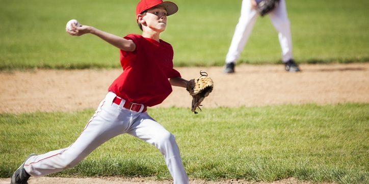 Young Male Baseball Pitcher Powers through Delivery little league elbow image