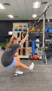 Patient working with a provider at a physical therapy clinic in Raleigh, NC during a functional movement assessment